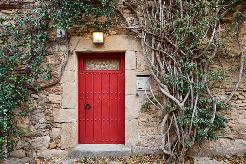 Picturesque medieval village of Peratallada. Red door. Costa Brava. Spain