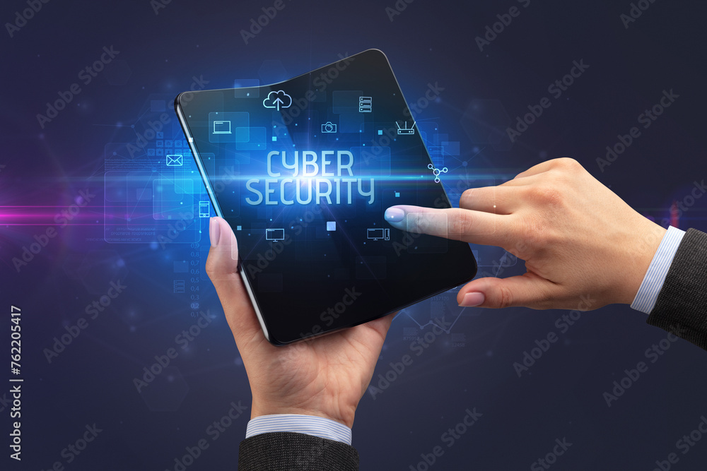 Businessman holding a foldable smartphone, security concept Businessman holding a foldable smartphone, security concept