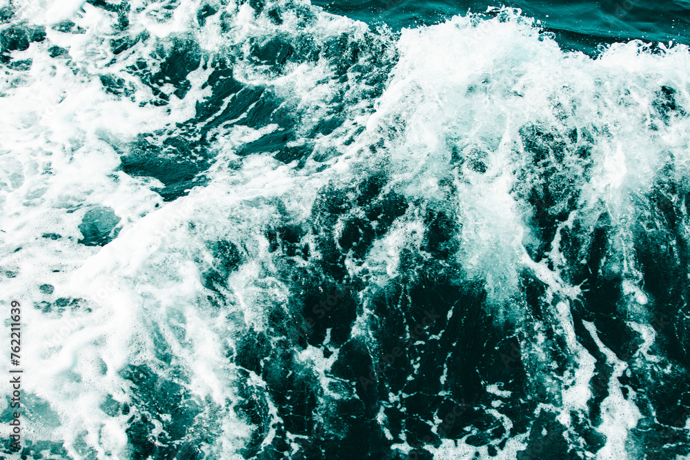 Fototapeta premium Blue sea waves in the ocean. Stormy winds at sea. horror concept The brutality of the sea.