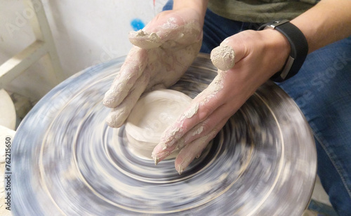 hands of a potter at work
