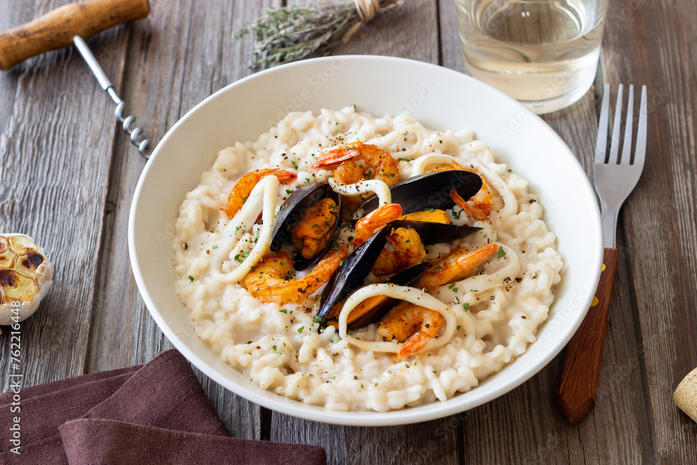 Risotto with mussels, shrimps and squid. Italian cuisine. Seafood. Risotto with mussels, shrimps and squid. Italian cuisine. Seafood.