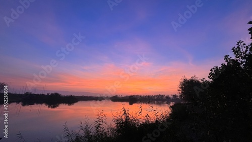 Golden Sunset Reflected in Serene Lake
