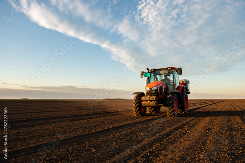 Tractor spreading artificial fertilizers © Vesna
