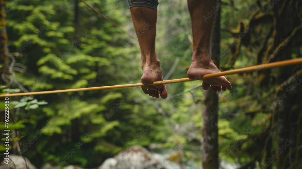 The challenging and mindful practice of slacklining, where balance and focus are key, typically performed between two anchor points