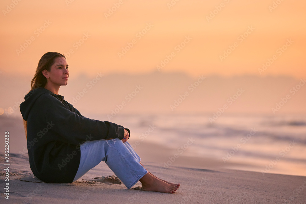 Casually Dressed Young Woman Watching Beautiful Sunrise Morning Over Beach And Sea In South Africa Casually Dressed Young Woman Watching Beautiful Sunrise Morning Over Beach And Sea In South Africa