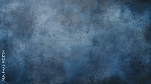 Abstract blue textured wall with a rough surface. The image resembles clouds, haze. A combination of blue and indigo tones. Background or backdrop for advertising, website, postcards