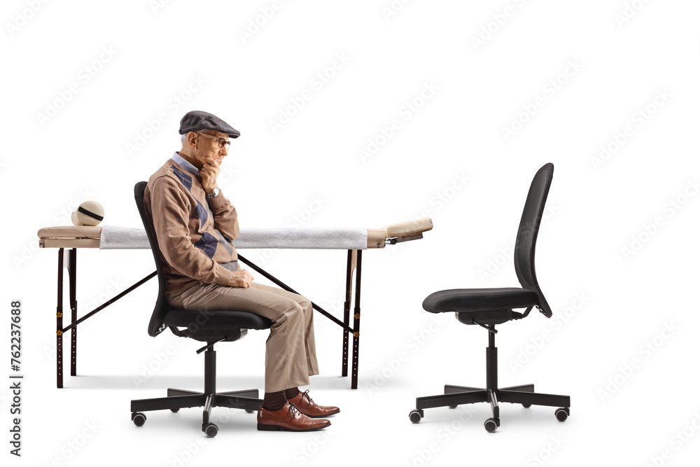 Elderly male patient sitting in a chair and waiting for a doctor Elderly male patient sitting in a chair and waiting for a doctor