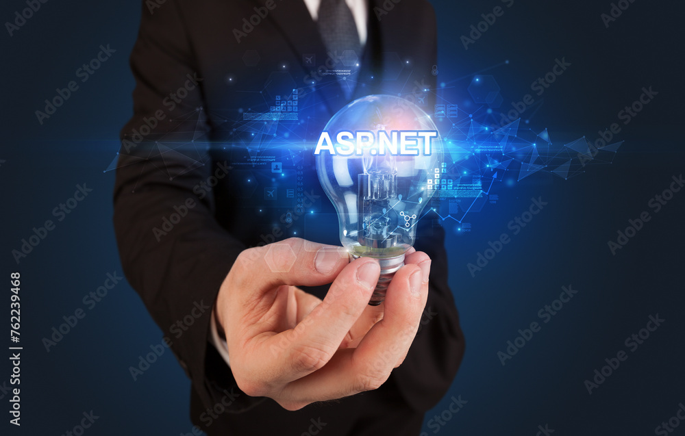 Businessman holding a light bulb Businessman holding a light bulb