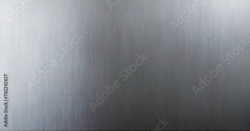 Dark, brushed metal surface with hairline texture, showcasing its industrial design and reflective quality. photo