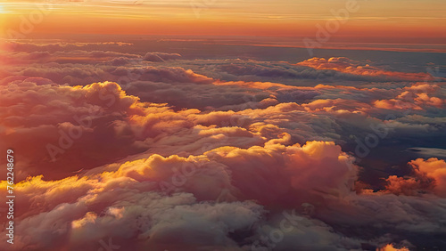 Enchanting aerial scene unveiling a dynamic sunset horizon. Wispy cloud arrangements grace the calm dusk overhead, witnessed from the elevated perspective of an airborne adventure.