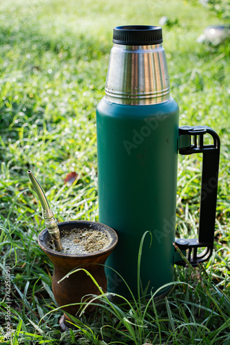 mate de porongo con yerba mate y termo.  photo