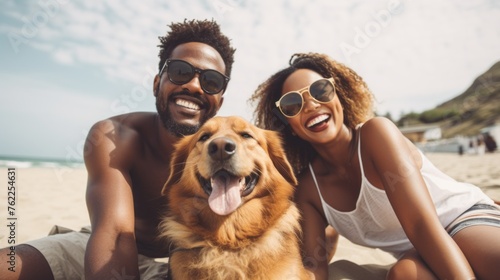 A happy smiling African American black couple with their beloved golden retriever dog on a seaside beach in summer. Travel, Vacation concepts.