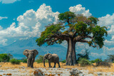 Elephants, Baobab tree and Mount Kilimanjaro in Amboseli National Park.