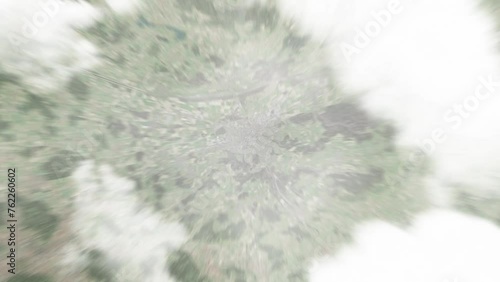 Earth zoom in from space to Frauenfeld, Switzerland. Followed by zoom out through clouds and atmosphere into space. Satellite view. Travel intro. Images from NASA photo