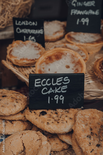 Fresh eccles cakes on a retail display of a bakery in Frome, UK. photo