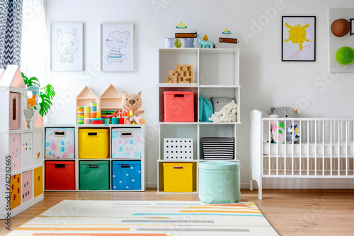 White nursery room with shelves and colourful boxes. © Tjeerd