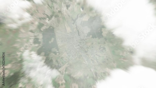 Earth zoom in from space to Lida, Belarus. Followed by zoom out through clouds and atmosphere into space. Satellite view. Travel intro. Images from NASA photo