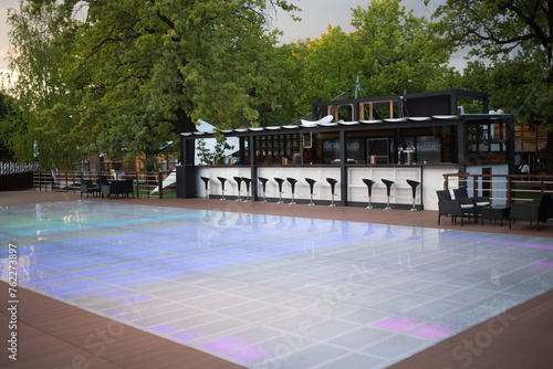 Photos Black and white bar with colorful dancefloor at the summer.