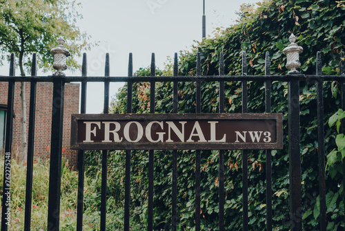 Street name sign on a metal fence on Frognal, Hampstead, London, UK. photo