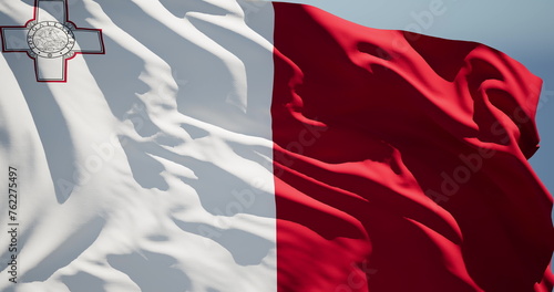 Foto Close-up of the national flag of Malta flutters in the wind on a sunny day