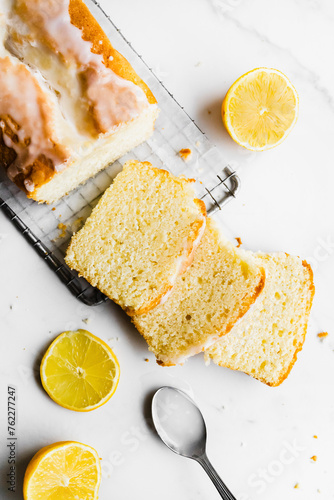 Sliced lemon pie on a white marble countertop