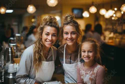 Two Women and a Girl Dining at Restaurant Table