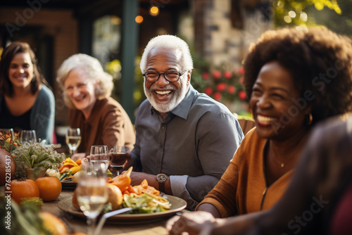 Senior man sitting at dining table with his friends and laughing, generative AI