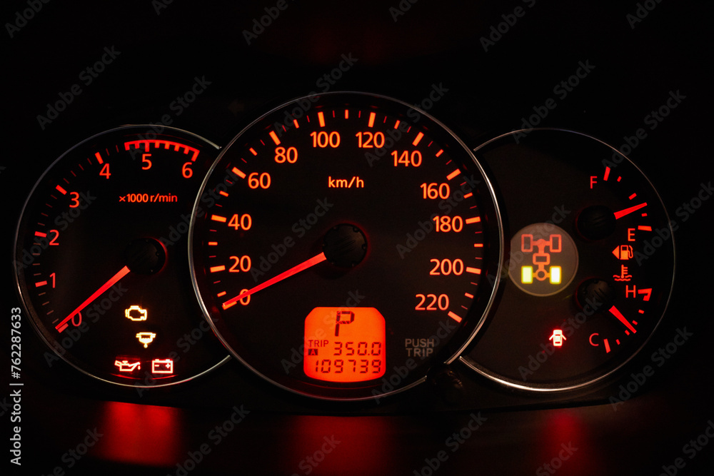 Fototapeta premium Car dashboard glowing in dark.