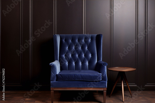 Blue velvet armchair and wooden table in dark room, 3d render © sakinahalima