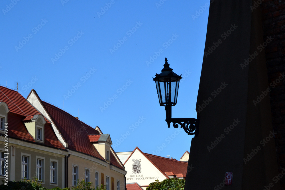 Gas street lamp, lantern. The Cathedral Island (polish: Ostrow Tumski) in Wroclaw, Poland. One of the few remaining places in Europe where a lamplighter lights the gas street lamps every evening Gas street lamp, lantern. The Cathedral Island (polish: Ostrow Tumski) in Wroclaw, Poland. One of the few remaining places in Europe where a lamplighter lights the gas street lamps every evening
