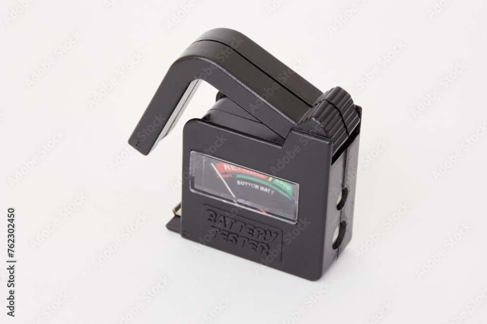 Portable battery tester on white background. Portable battery tester on white background.