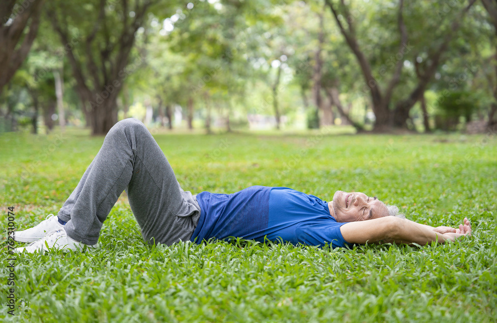 healthy asian senior man in sportswear lying on grasses in the summer park,mature male relaxing in nature after exercise,concept of elderly lifestyle,health care,exercise,resting,wellness,wellbeing healthy asian senior man in sportswear lying on grasses in the summer park,mature male relaxing in nature after exercise,concept of elderly lifestyle,health care,exercise,resting,wellness,wellbeing