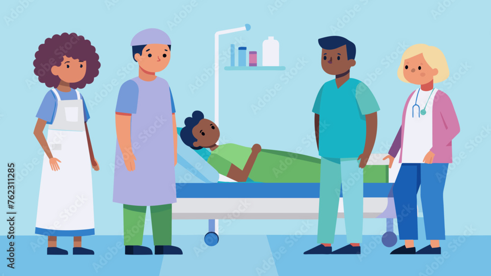 A doctor in scrubs standing at the foot of a hospital bed discussing the with a patient and their family. The patient is wearing a hospital gown A doctor in scrubs standing at the foot of a hospital bed discussing the with a patient and their family. The patient is wearing a hospital gown