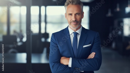 business man ceo wearing suit standing in office looking at camera . Smiling mature businessman professional