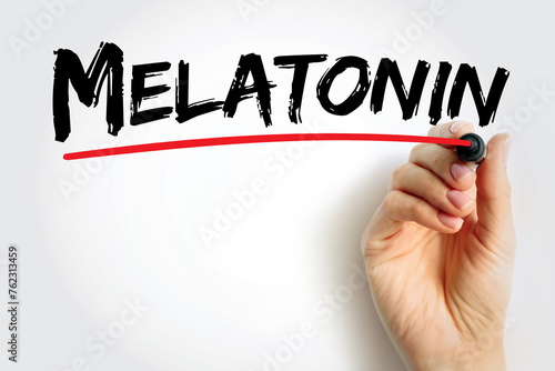 Melatonin is a hormone that your brain produces in response to darkness, text concept background photo