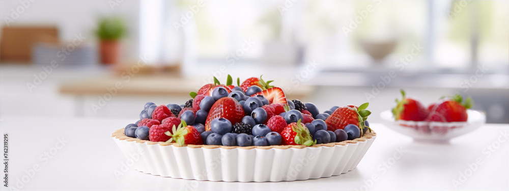 Close-up of a ceramic bowl filled with fresh strawberries, blueberries, and blackberries on a white table with a blurred background. Close-up of a ceramic bowl filled with fresh strawberries, blueberries, and blackberries on a white table with a blurred background.