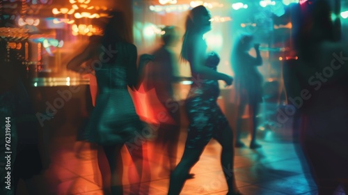 People dance in the blurred glow of club lights, immersing themselves in the vibrant nightlife of the party scene.