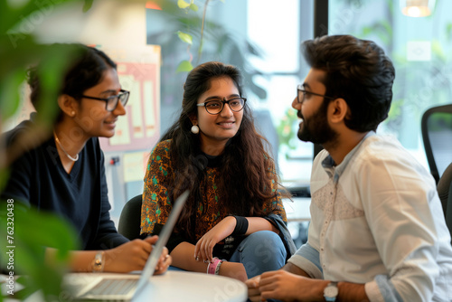 Team of Three Diverse South Asian Software Developers Talk Discuss a Technological Project. Empowered Indian Female Specialists and Two Colleagues Work on Digital Software as a Service Business
