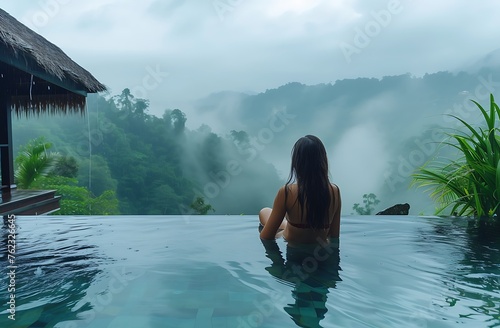 Tranquil Moment: Woman Finds Serenity in a Rain-Kissed Pool with Mountainous Backdrop, Offering Copyspace, AI-Generated © fahad