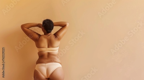 The delicate female body are showcased against a neutral beige backdrop, accentuating elegance and sensitivity.