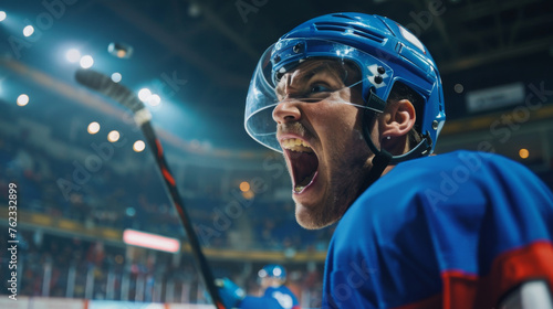 A victorious hockey player exults amidst the roar of the stadium, celebrating the win passionately in a blue jersey, embodying the emotional triumph of the game. photo