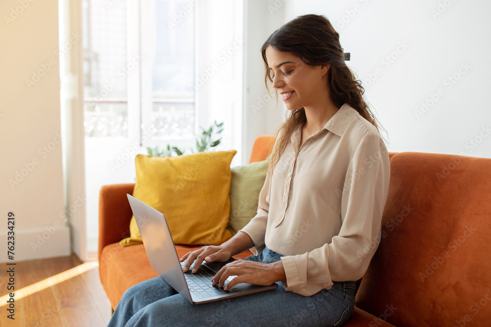 Female Study Or Working With Laptop While Sitting On Couch At Home Female Study Or Working With Laptop While Sitting On Couch At Home