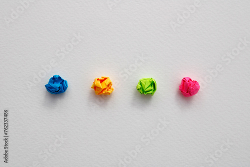 Fotografie Notes of different colors in a row crumpled and discarded