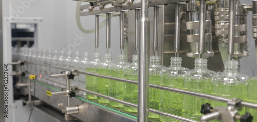 chemical liquid sanitiser gel fills in bottles aqueous soap hand wash detergent production line filling making process in a plastic transparent bottle manufacturing factory