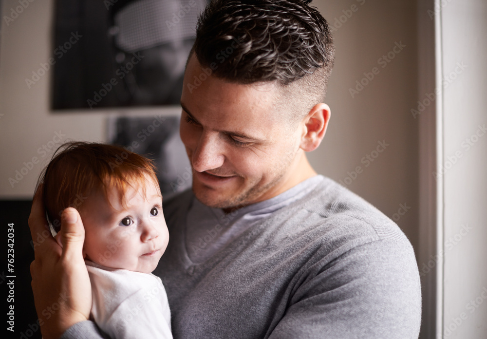 Father, baby and pride with hug for bonding, love and happiness with child development and parenting. Peace, calm and childhood with smile, man and newborn kid for tender moment at family home Father, baby and pride with hug for bonding, love and happiness with child development and parenting. Peace, calm and childhood with smile, man and newborn kid for tender moment at family home