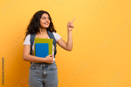 Student looking and pointing upwards