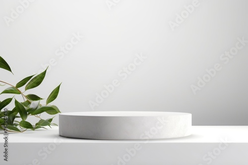A white pedestal with a plant in the background. Ideal for interior design concepts © Fotograf