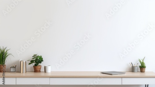 A desk with a book and a plant, suitable for office or home decor