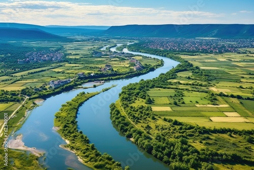 Scenic view of a river flowing through a lush green valley. Perfect for nature and landscape concepts