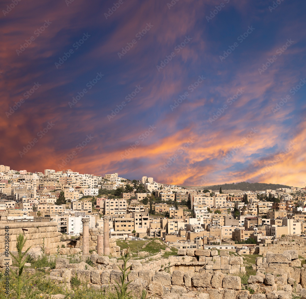 Roman ruins (against the background of a beautiful sky with clouds) in the Jordanian city of Jerash (Gerasa of Antiquity), capital and largest city of Jerash Governorate, Jordan